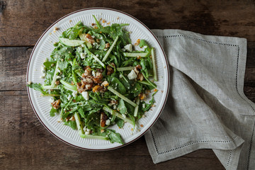 A gourmet salad on rustic surface, horizontal, top view