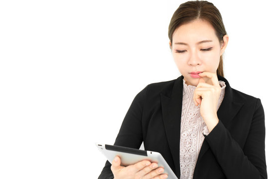 Asian beauty business woman in formal suit holding taplet on white background