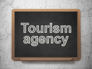 Tourism concept: Tourism Agency on chalkboard background