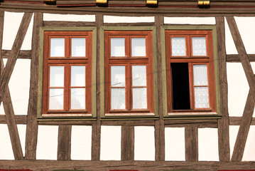 Windows of a traditional half timbered house seen in Germany