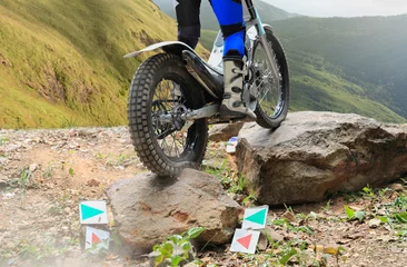 Foto op Aluminium Trials motorcycle is jumping over rocks © toa555