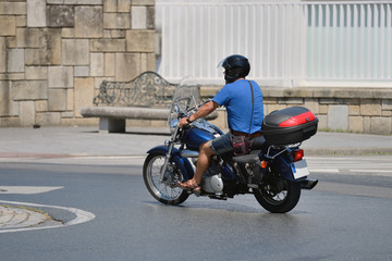 Obraz na płótnie Canvas motorcyclist on the road in the city