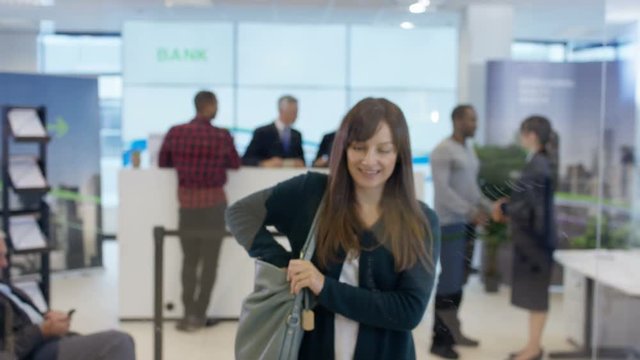  View behind screen of customer in modern bank using interactive atm machine