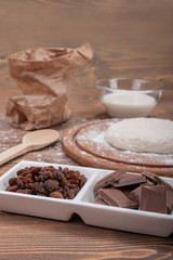 Food ingredients for dough a wooden kitchen board. Cake recipies