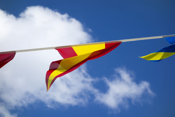 The flag of Spain under the blue sky