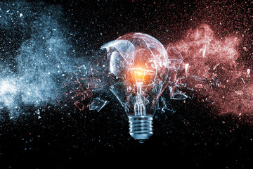  high speed photograph  traditional electric bulb  exploded. concept of fragility and creativity.
