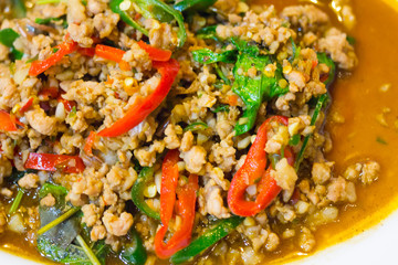 stir-fried with minced pork and basil on white plate (Ka Prao Moo)