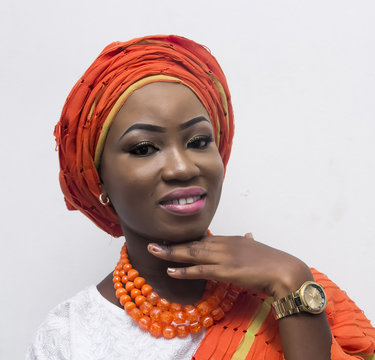 a young African lady in complete Yoruba attire