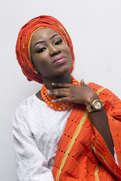 a young African lady in complete Yoruba attire