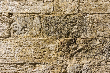 Texture of wall in italian tuscany town from tuf stone