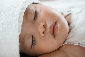 Toddler asian girl sleeping 1.8 years old portrait, child sleep tight day time, recuperation because of sickness