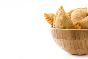 Gordijnen Typical Spanish empanadas in bowl isolated on white background © chandlervid85