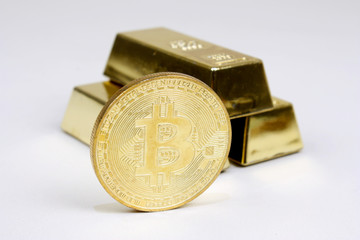 Bitcoin mit Goldbarren