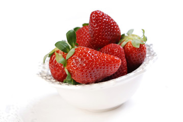 Fresh strawberries in the small ceramic bowls
