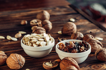 Dried nut is useful and natural on a wooden substrate. Appetizing