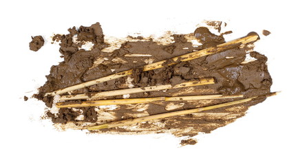 Mud and hay straw isolated on white background, with clipping path
