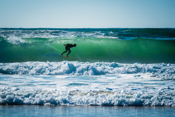 surfer silhouette - inside a wave