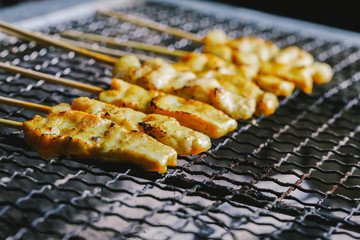 Pork satay skewer grill on charcoal stove.