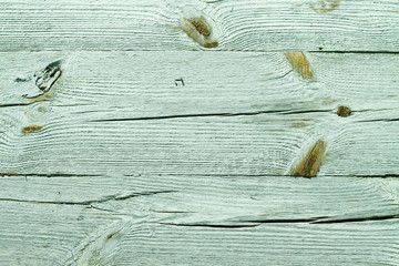 Ancient vintage wooden texture. A painted green, blue wall. Cracked paint. Grunge colored background for design. Stock Photo