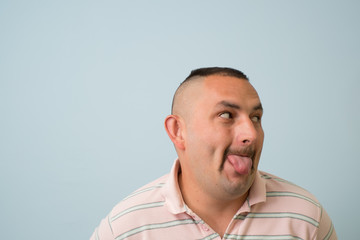 man shows his finger on the tongue