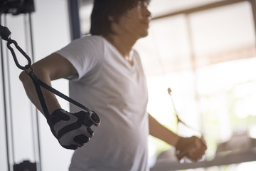 man exercising in fitness gym for good health.