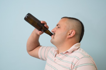 The man drinks beer