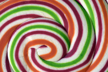 Fototapeta na wymiar Close-up of colorful lollipop in spiral shape