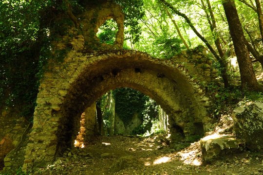 ruins of old paper mill in forest in Valle delle Ferriere, Amalfi Coast, Italy
