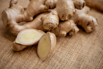Ginger on black table with sack fabric