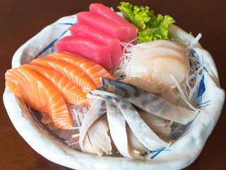 Japan luxury tradition food "Sashimi" contain about raw sea fish such as salmon , tuna , mackarel , scallop serve with wasabi and shoyu sauce