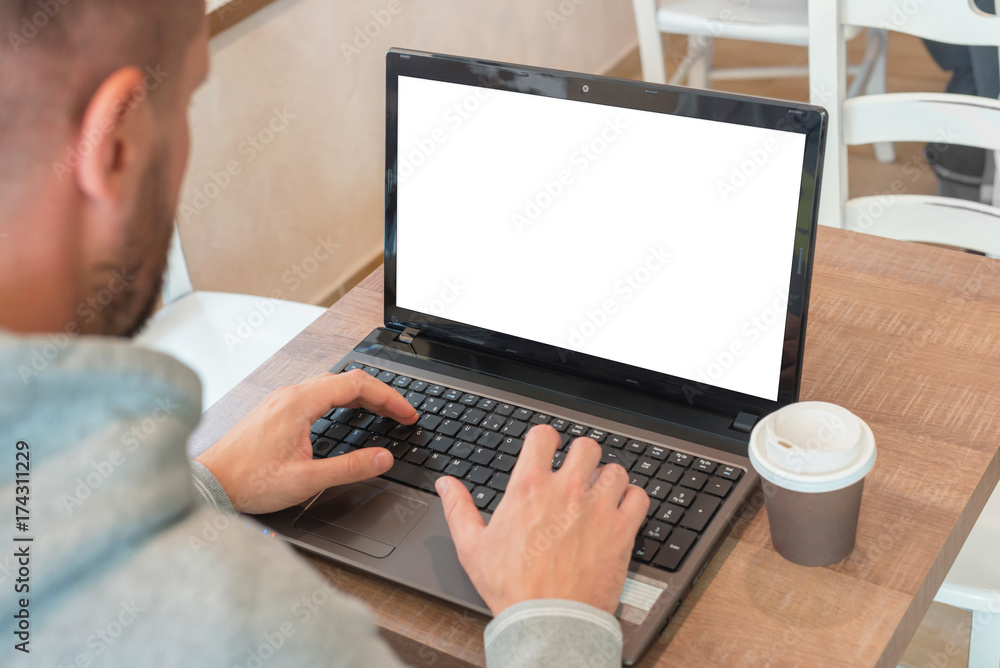 Poster Man work on laptop computer with isolated blank screen for web site presentation mockup.