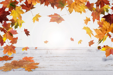 Naklejka na ściany i meble autumn red and orange leaves with heart fall white wooden background