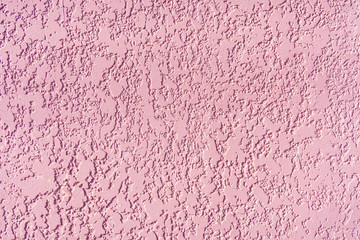 Background of pure pink decorative plaster. Texture or backdrop of interior plaster or putty.