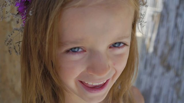Portrait of happy little girl smiling at camera. 4K