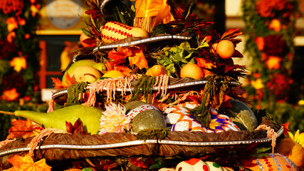 Colorful pumpkins on the fair, painted halloween pumpkins, autumn background