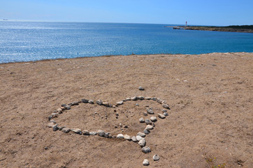 Hiking in the Calanques, view of a heart with stones, the south of France