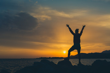 Fototapeta premium Girl hiker with arms outstretched enjoy beach and sea