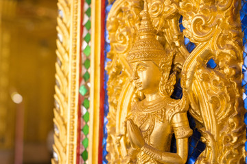 Thai golden statue with beautiful traditional texture.