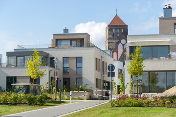 Modern Building - Family home with old church bell tower in the background