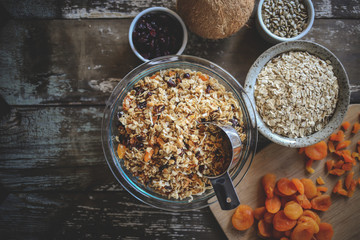 Homemade granola with dried apricots, cranberries, coconut, sunflower seeds, and oatmeal