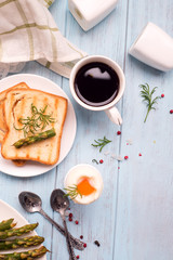 Breakfast with egg and a cup of coffee