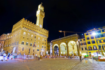 View of the Piazza della Signoria and Palazzo Vecchio in Florence at night.