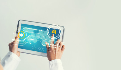 Close of female doctor hands working with tablet pc computer