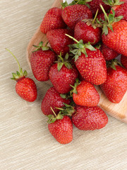 Beautiful ripe strawberry on a fabric background