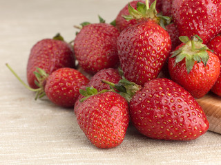 Beautiful ripe strawberry on a fabric background