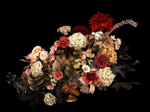 Fototapeta Floral arrangement, autumn bouquet, on black background. Toned image.