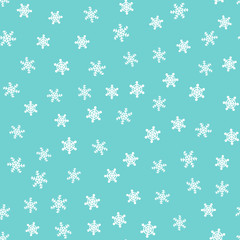 Winter seamless pattern. Drawn by hand. White snowflakes on blue background. Template for design of postcards, covers, clothes.