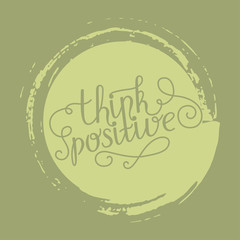 Hand lettering think positive on grunge brush background