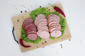 different kinds of sausage and salad