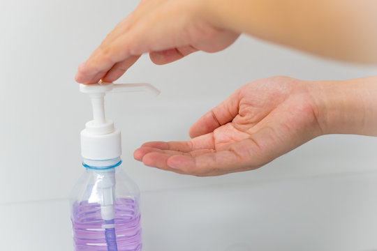 Applying  liquid soap for washing hands